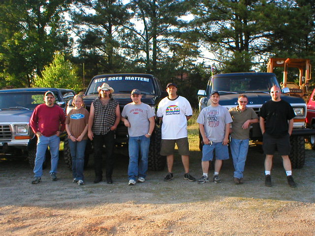 Group posing in front of lifted Ford Bronco with SIZE DOES MATTER windshield banner