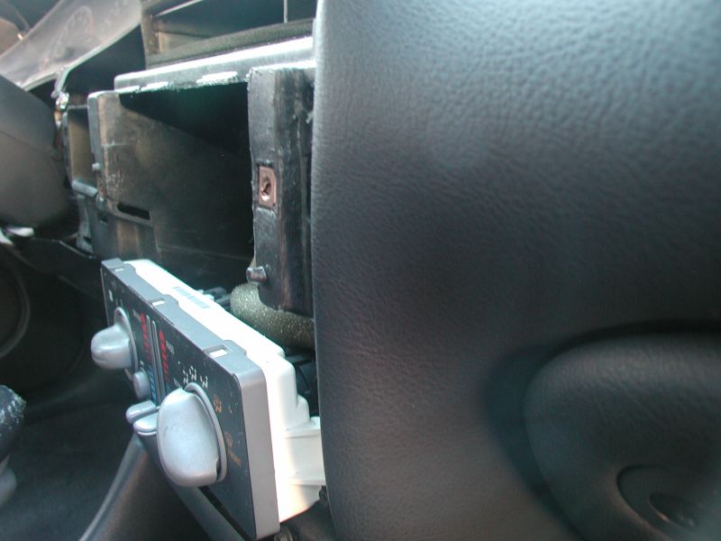 2002 Pontiac Grand Prix center console climate controls and disassembled dashboard.