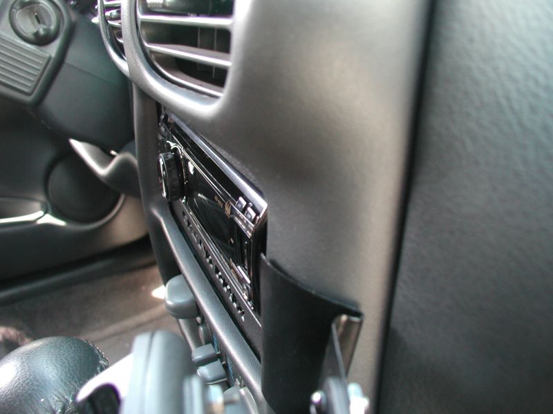 It sticks out no further than the factory stereo.