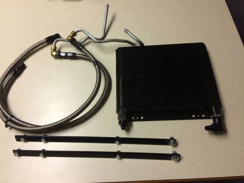 Black oil cooler kit with braided lines and mounting brackets.