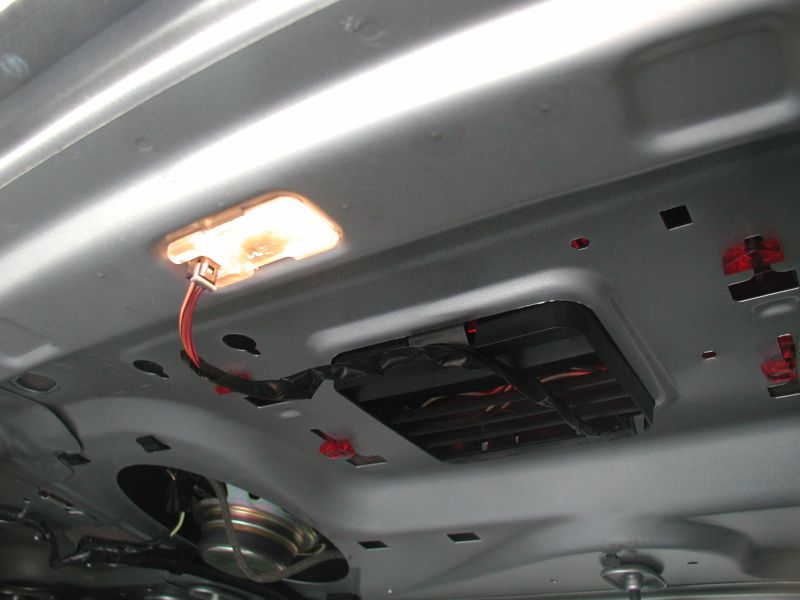 Put the light assembly into the opening just rearward of the 3rd brake light opening. My light had no way of fastening into the opening, so I can only assume that it was broken; I used some two-sided tape to hold it in place.