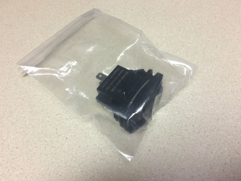 Black dual USB car charger in plastic bag, input 12/24V DC, output 5V 2.1A DC