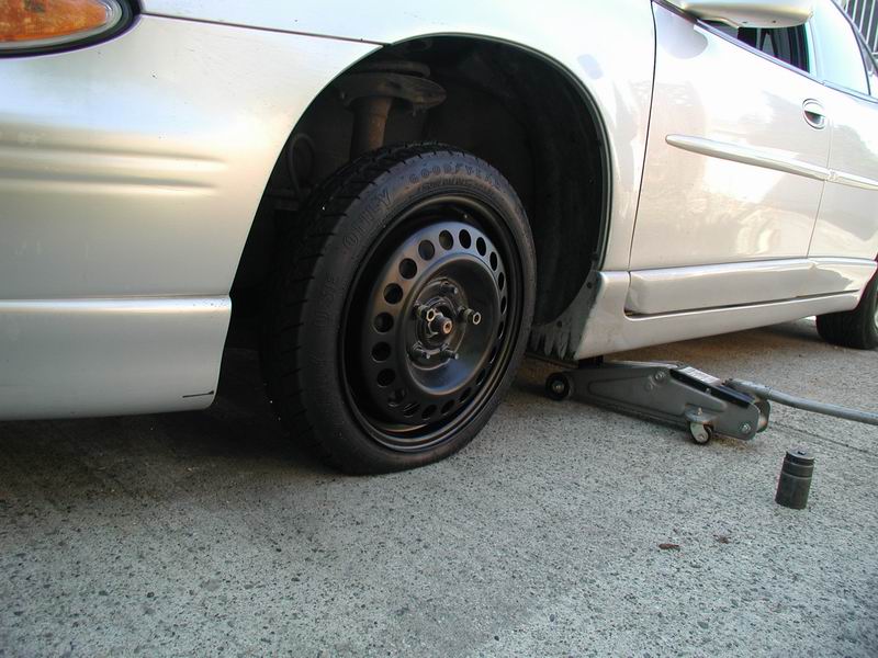 The spare tire allows room for the 36mm hub socket. An old roof rack cross bar makes a great breaker bar.