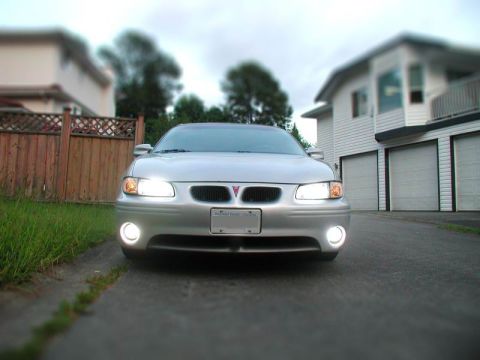 Silver 2002 Pontiac Grand Prix front view, headlights on