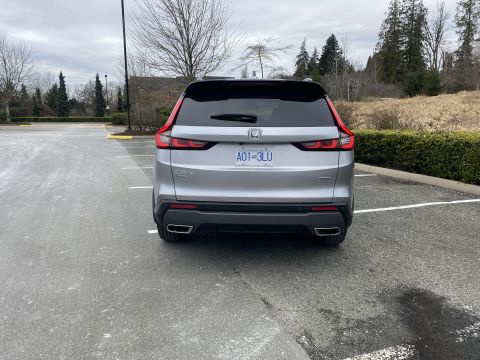2026 Honda CR-V - The rear of a silver Honda CR-V is parked in an outdoor parking lot on a cloudy day. The license plate reads A01-3LU.