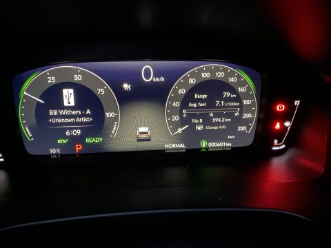 2026 Honda CR-V - The digital dashboard of a 2026 Honda CR-V shows the current speed, range, average fuel consumption, and music playback information.