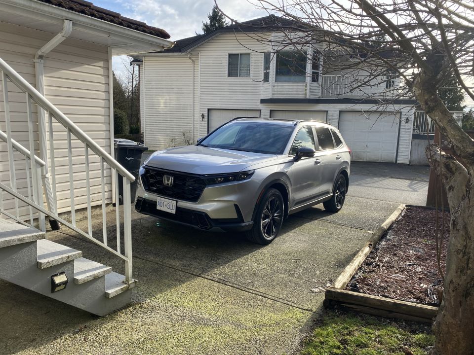 Silver Honda CR-V SUV parked in driveway