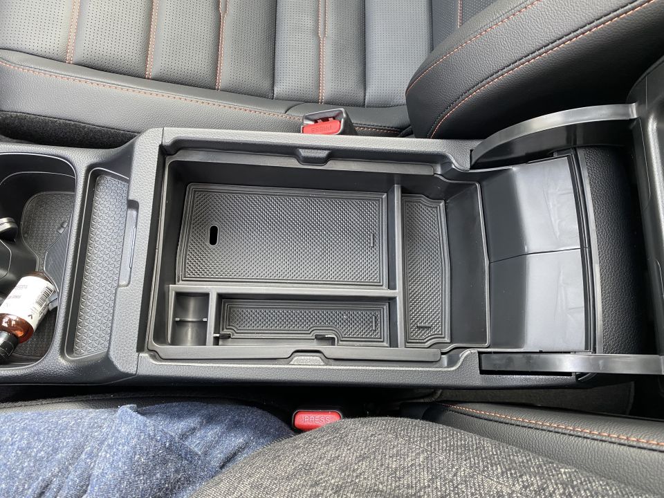 Installing the armrest tray.