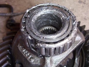 2000 Ford F-450 - Close-up of a damaged differential gear assembly, showing significant wear and tear on the bearings.