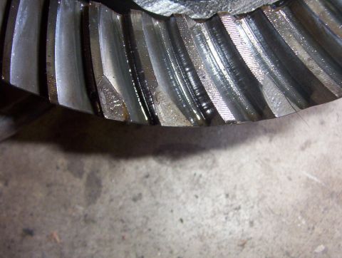 2000 Ford F-450 - Close-up view of damaged gear teeth, likely from a differential or transmission.