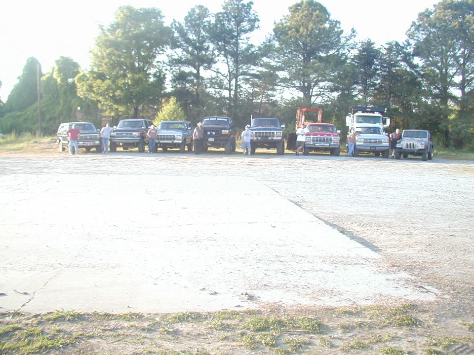 Lineup of SUVs and trucks parked outdoors