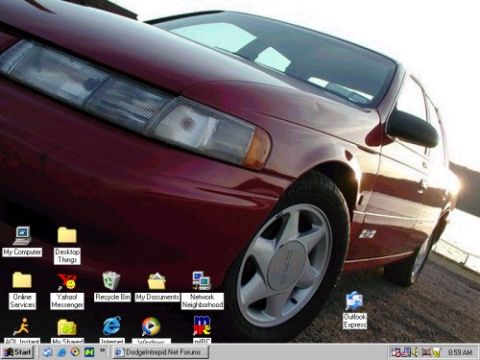 1997 Ford Taurus - A red 1997 Ford Taurus is shown in a 3q-front view, with a computer desktop overlay.