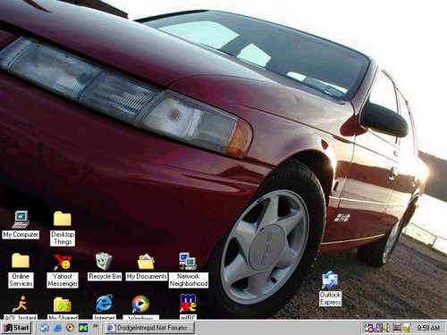 Red 1997 Ford Taurus 3q-front view with desktop icons
