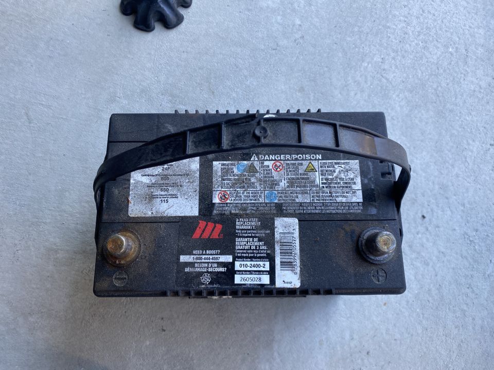The old battery; almost 5 years old and just shy of 42,000km on it.