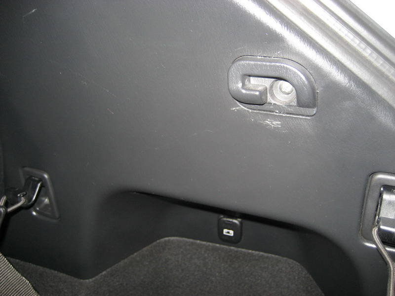 Interior cargo area of a 2009 Mazda CX-9 showing tie-down hooks and a USB port.