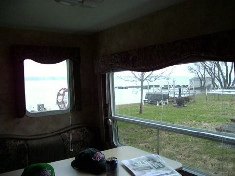 1992 Ford Bronco - View from inside a recreational vehicle shows a table with items and a scenic outdoor landscape.