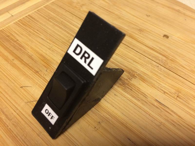 I made this plastic switch holder for the cubby, but the adhesive wouldn't hold and it ended up falling to pieces as I installed it.....