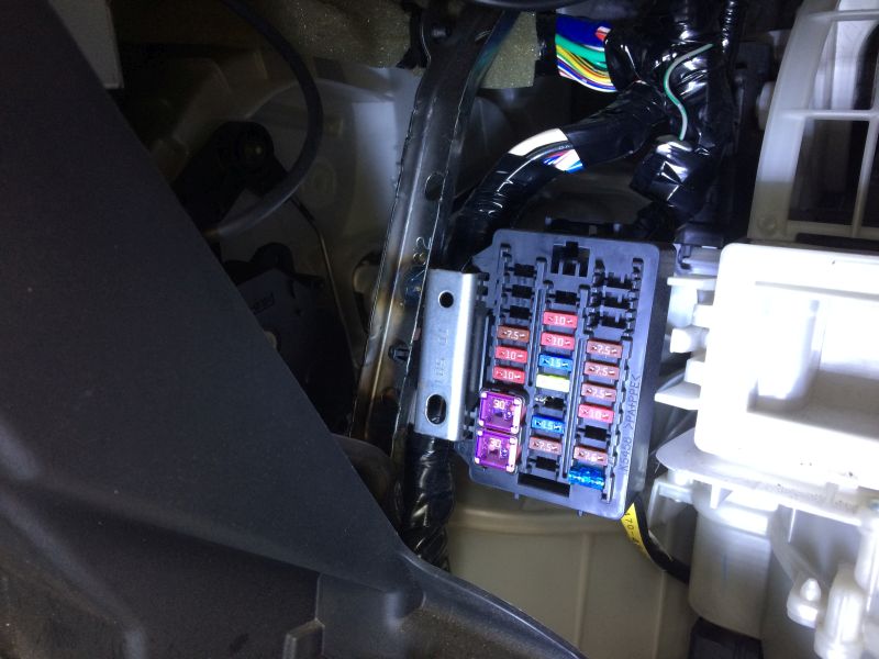 The mounting place, and the fuse to be "tapped"