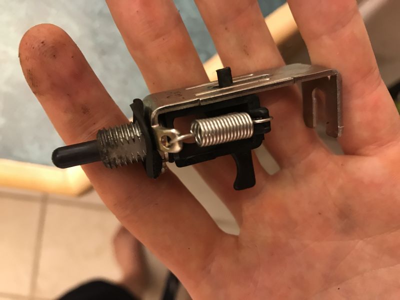 Mechanical switch part with spring held in hand