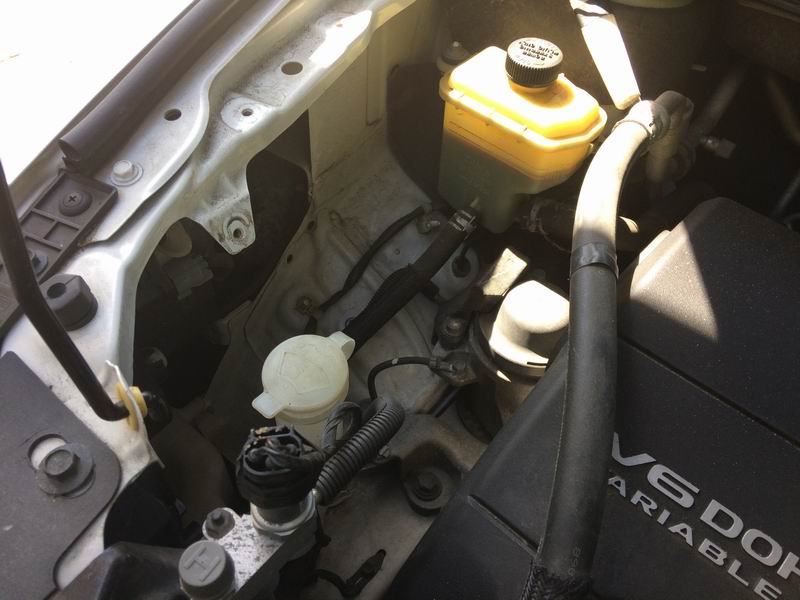 Right side: remove the 3 10mm bolts and move the coolant overflow tank out of the way.
