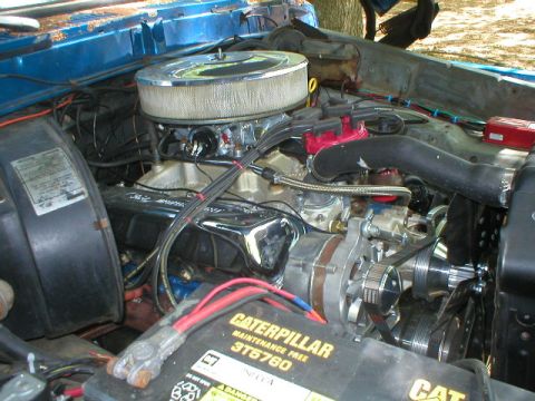 1978 Ford Bronco - Close-up view of a vehicle's engine bay, showing various components and wiring.