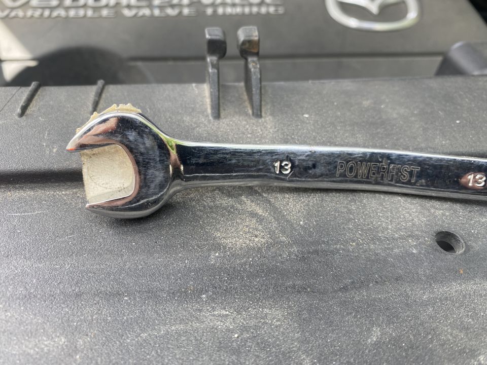 13mm wrench "modified to access the upper ball mount nut.