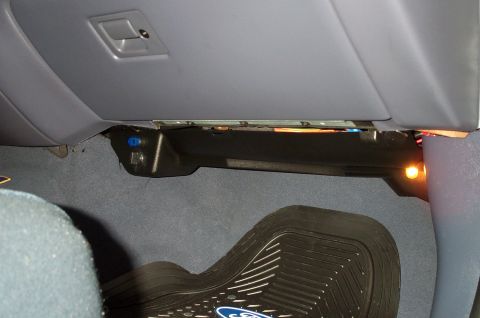1998 Ford Crown Victoria - A close up of the passenger side panel with the auxillary outlet. I installed the toggle switch.