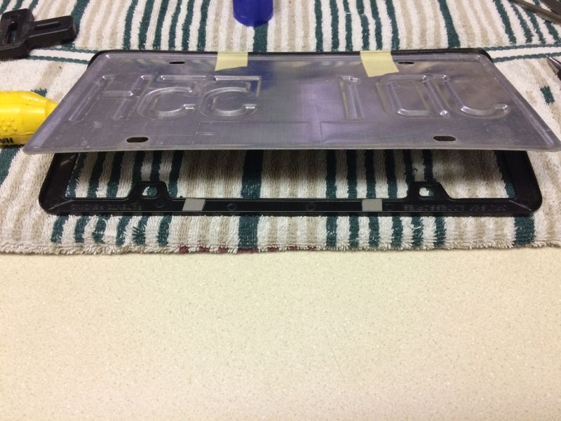 I was worried that the bottom of the plate and frame would rattle or vibrate, so I stuck them together with some two-sided tape