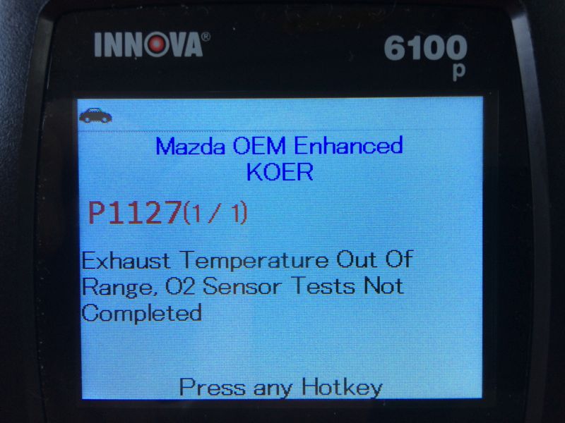 Innova 6100 diagnostic scanner showing Mazda P1127 error code.