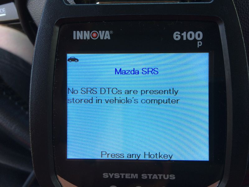 Innova 6100p diagnostic tool screen showing Mazda SRS system status.