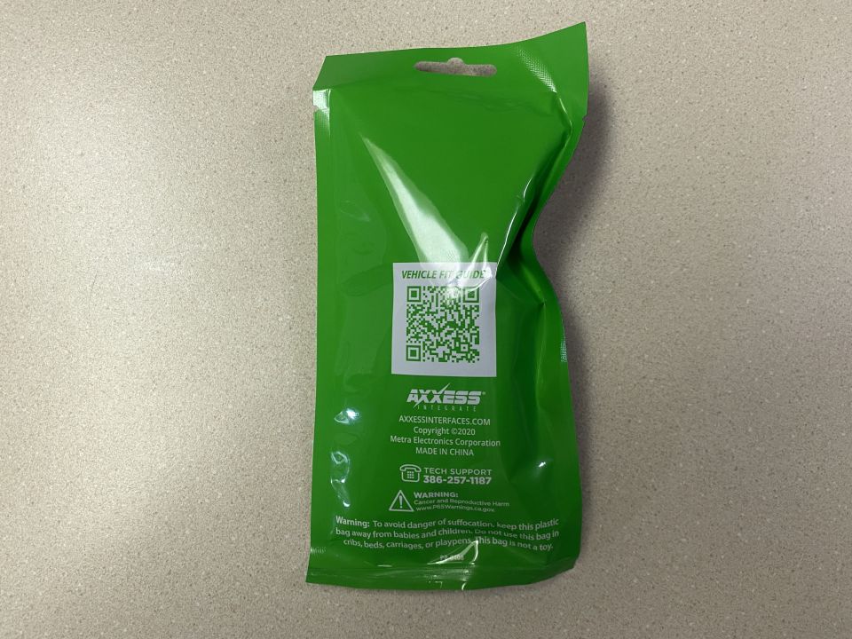 Green plastic package with Axxess Interfaces logo and product information.