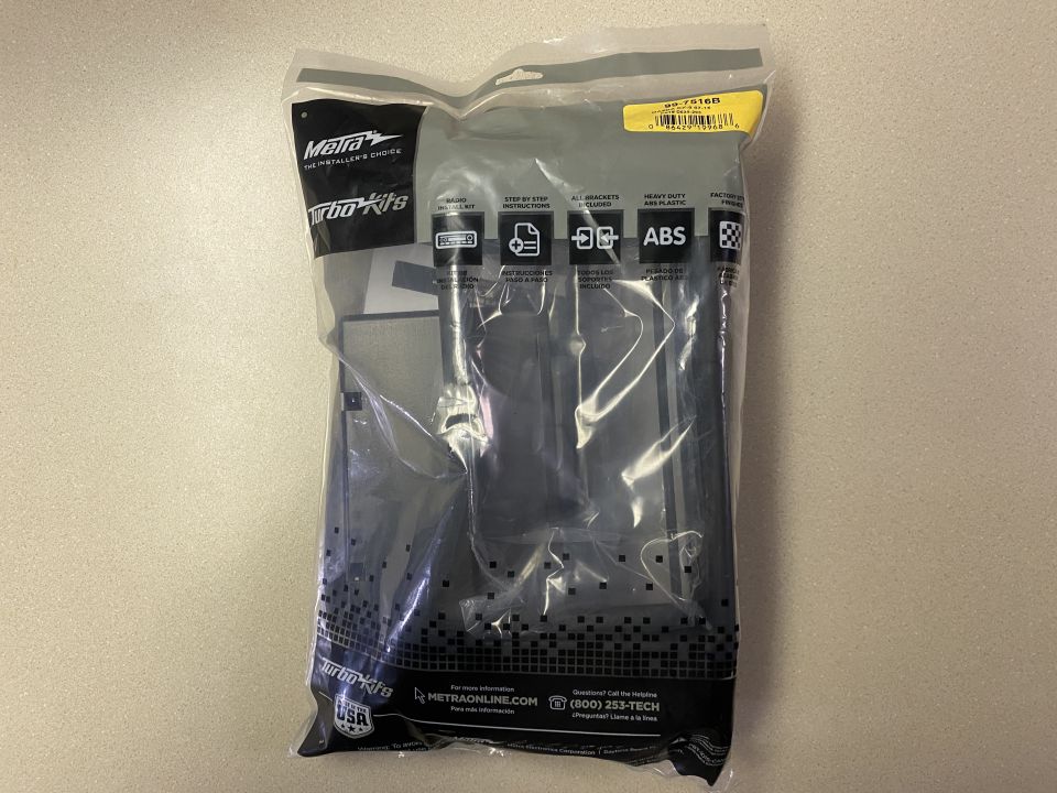 Metra Turbo Kits radio installation kit in a plastic bag.