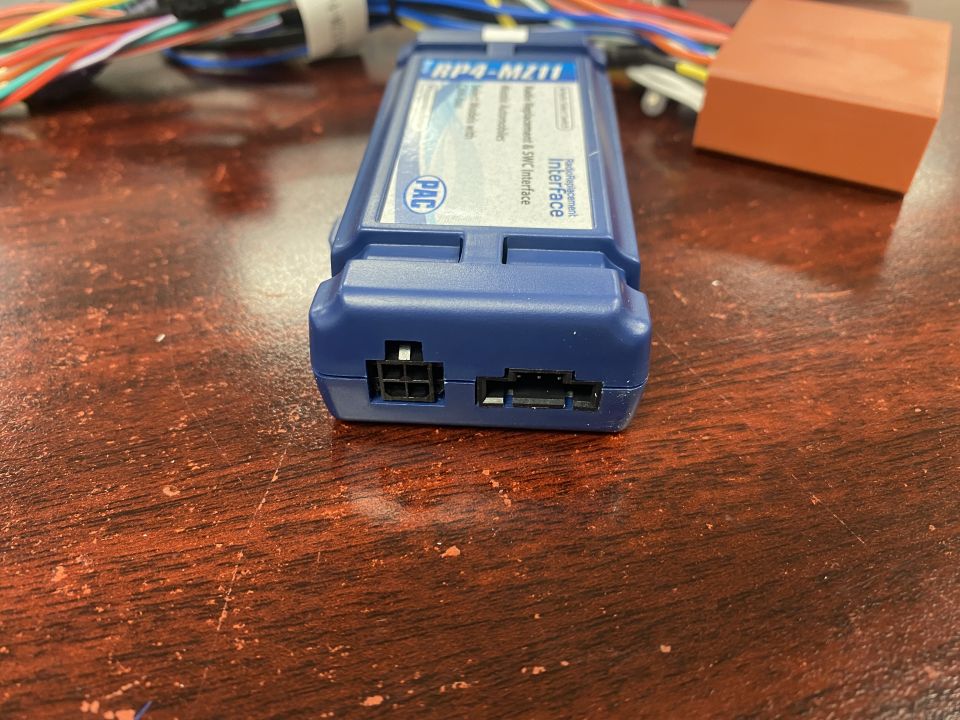 Blue PAC RP4-MZ11 interface module with wiring harnesses.