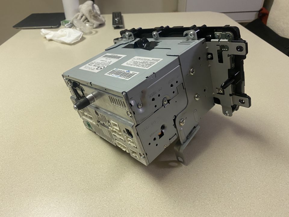 Car stereo unit with mounting brackets and connectors
