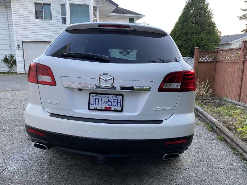Rear view of a white 2009 Mazda CX-9 SUV with BC license plate JD1 55H