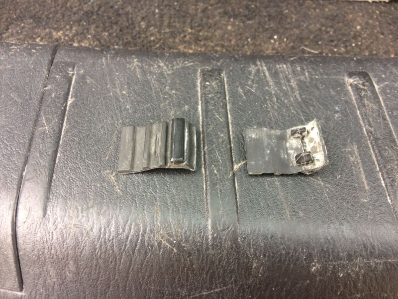 The other day one of these was "dangling" from the bottom of the tailgate. I removed them both to deal with later.