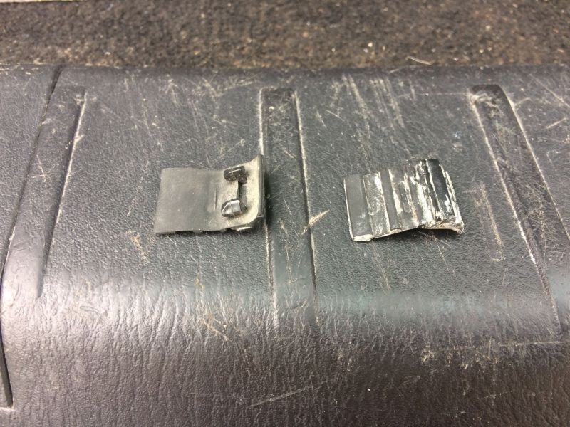 The other day one of these was "dangling" from the bottom of the tailgate. I removed them both to deal with later.