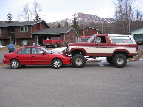 1985 Ford Bronco - Up against my moms car. Didn't think I would could get this far up the hood.