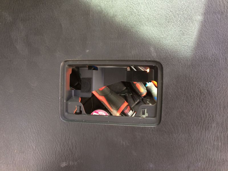 Tools inside a vehicle's interior storage compartment