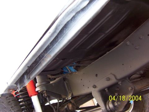 1978 Ford F-150 - Close-up of the undercarriage of a truck, showing the frame and suspension components, with a date stamp of 04/18/2004.
