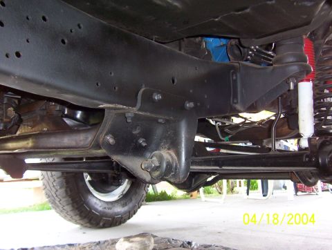 1978 Ford F-150 - Undercarriage view of a 1978 Ford F-150, highlighting suspension parts and frame structure.
