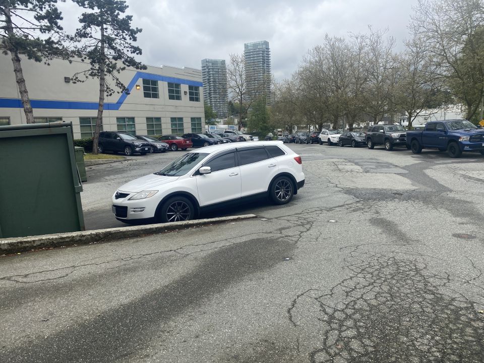 White 2009 Mazda CX-9 parked in an outdoor lot.