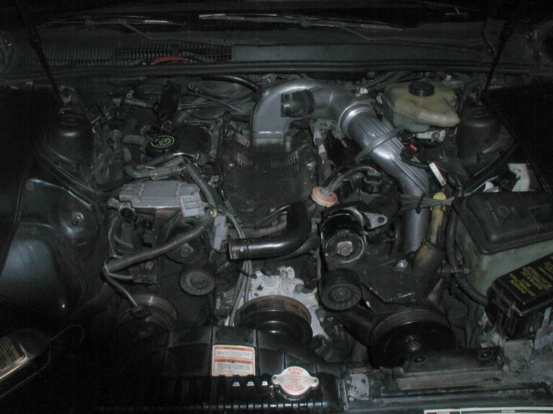 1990 Ford Thunderbird engine bay, V6 engine, hoses, belts, air intake
