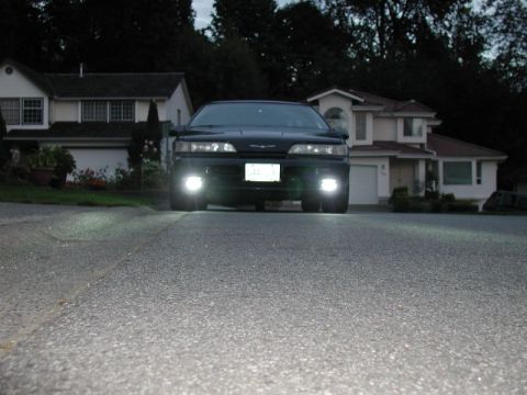 1990 Ford Thunderbird - Driving lights only, camera at ground level, flash on.
