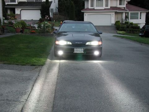 1990 Ford Thunderbird - Headlights and driving lights, camera at chest height, flash on.