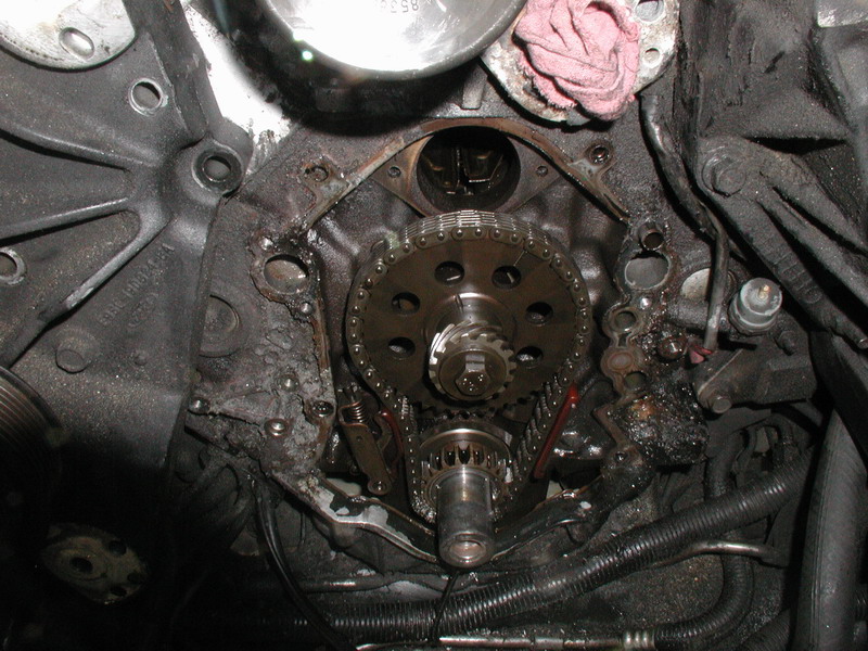 The left side (right side in the picture) seemed to hang up, but I figured it was the silicone on the oil pan. She cracked free after some delicate prying and pounding.