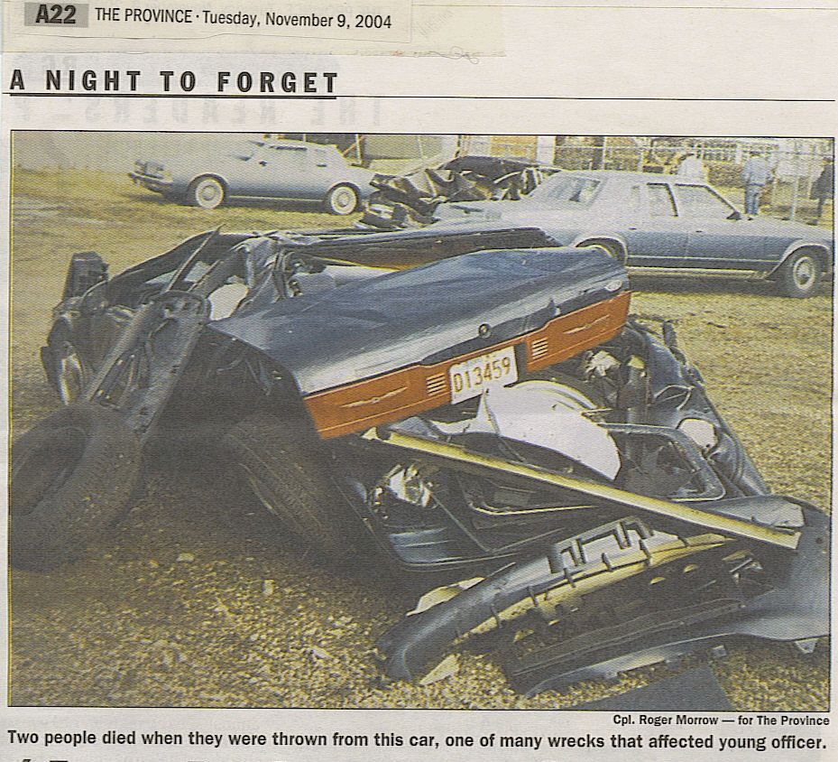 Heavily damaged car wreckage with license plate 013459 visible.