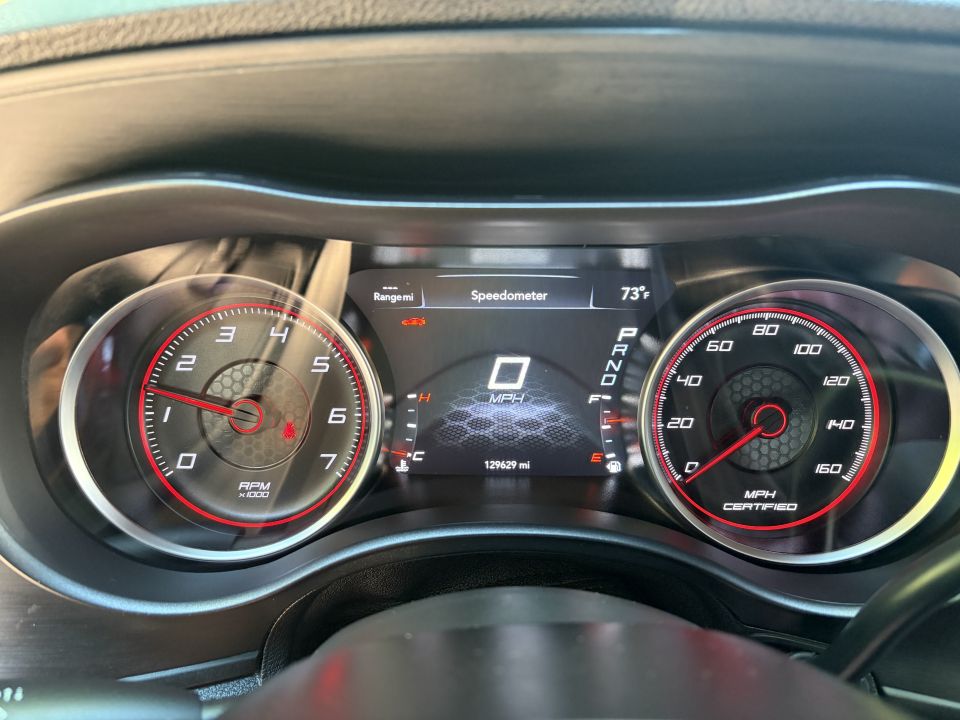 Lit gauge cluster with tachometer, 160 mph speedometer and 129,629 mile odometer
