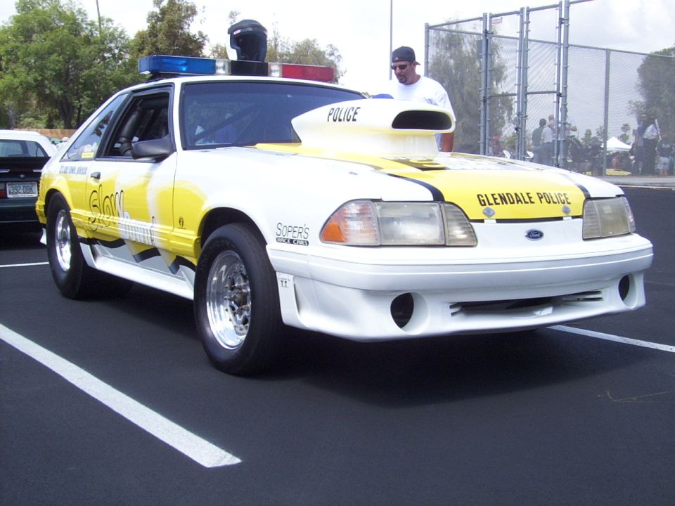 Modified Ford Mustang with "Glendale Police" markings and a large hood scoop
