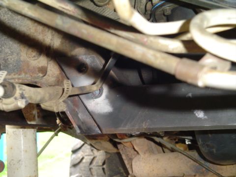 1993 Ford Bronco - Underside view of a vehicle's chassis, showing structural elements and various lines.